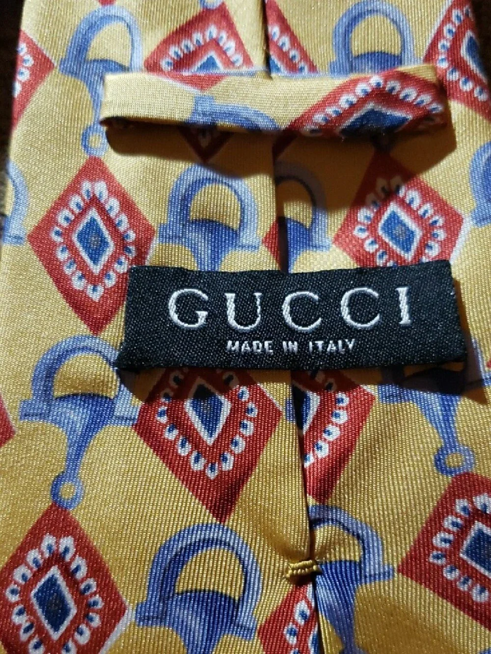 GUCCI Yellow Geometric Silk Tie with Red and Blue Motif
